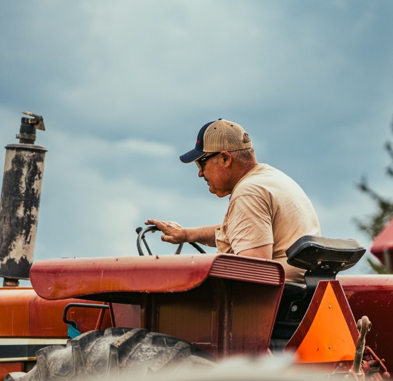 Farm Rescue volunteer on tractor