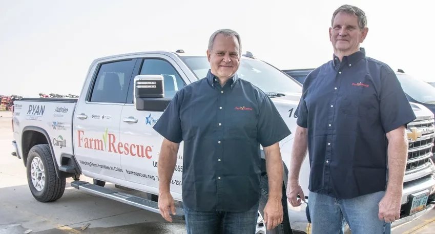 Two farmers and a truck