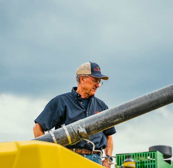 Farmer Emptying Grain